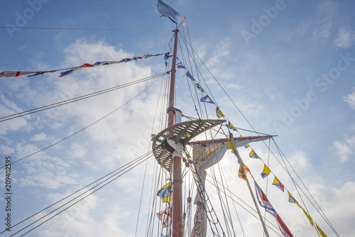 Rigging of a tall ship in a port in sunlight in spring