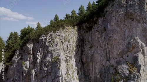 Panning and Lowering Close Up of Rugged Rugova Mountains of Kosovo photo