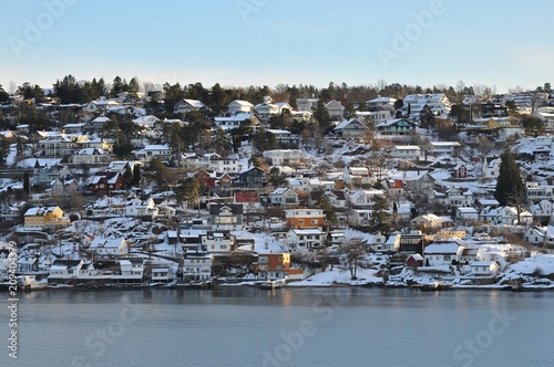 Colorful houses on fjord in Oslo, Norway- with beautiful sky and sea in the morning