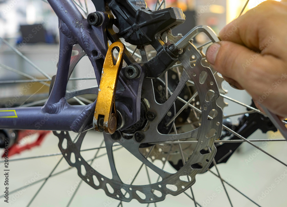Fototapeta premium Bicycle Maintenance- Repairing the Disc Brakes on a Mountain Bike