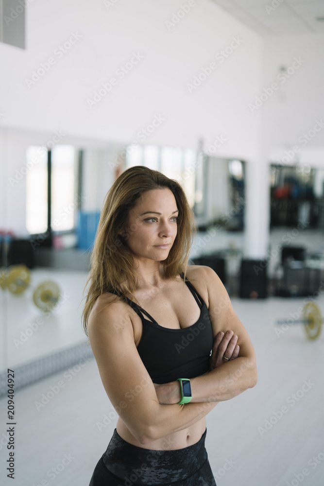 Close up image of attractive fit woman in gym