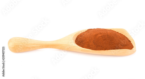 Coffee powder in wood scoop isolated on white background