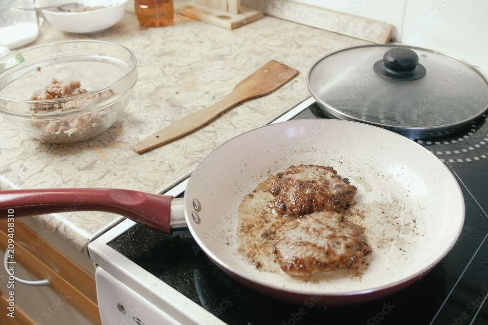 Cutlets frying on the pan for burgers. Cutlets frying on the pan for burgers.