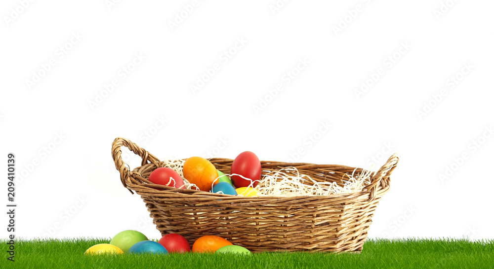 Easter basket with Easter eggs at 3d rendering green grass meadow