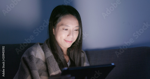 Woman look at tablet computer at home