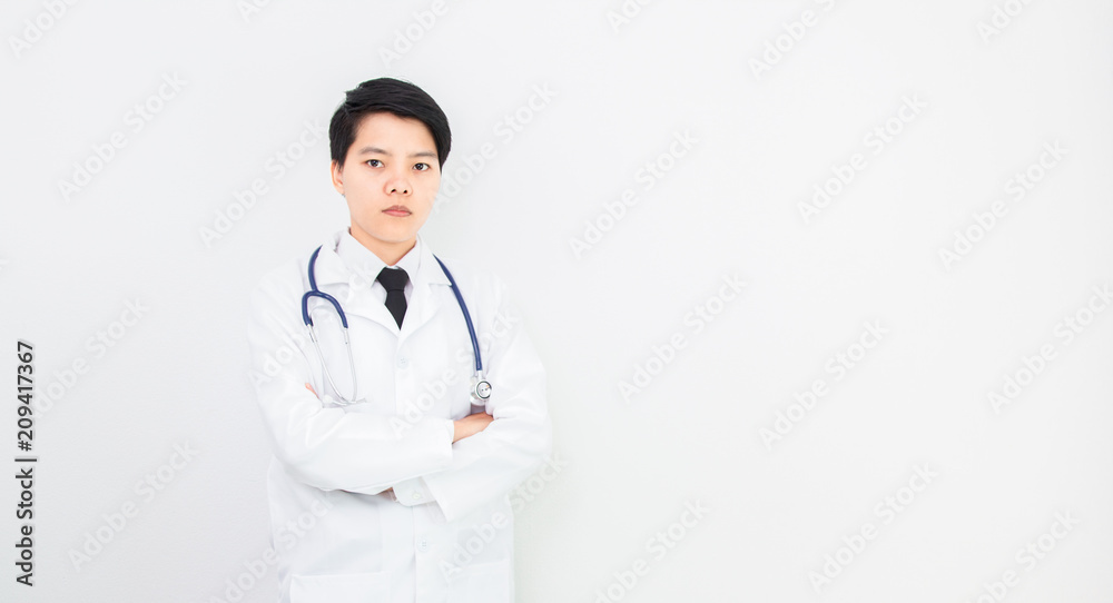 Soft focus and blurred. Homosexuality of asian doctor woman taciturn look to camera with stethoscope on gray background. Soft focus and blurred. Homosexuality of asian doctor woman taciturn look to camera with stethoscope on gray background.