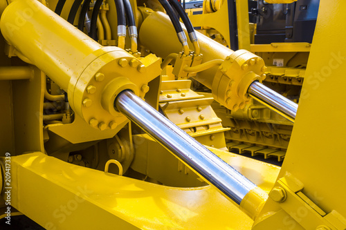 Hydraulic piston system for bulldozers, tractors, excavators, chrome plated cylinder shaft of yellow machine, construction heavy industry detail