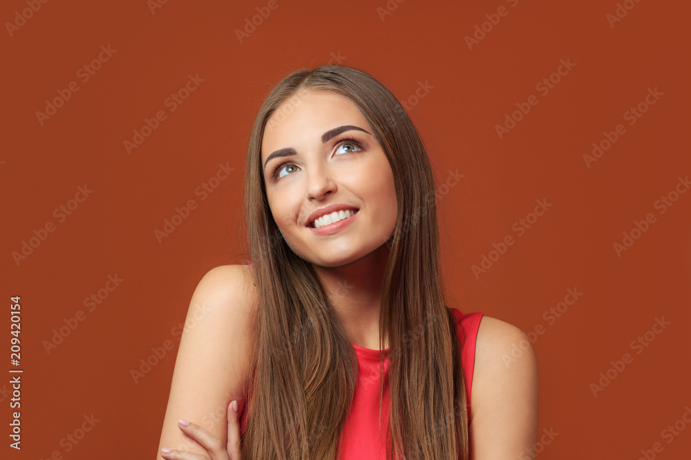 Naklejka premium Happy beautiful girl looking up