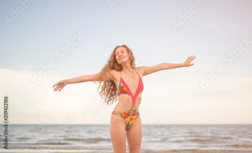 beautiful sexy woman in bikini swimsuit. freedom and relax in beach © saksit