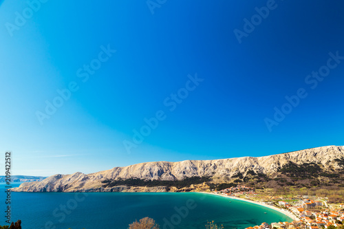 The bay of Baska in a sunny day photo