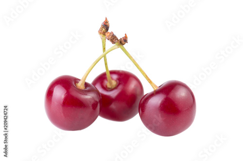 Three cherry ripe red berries isolated on white background