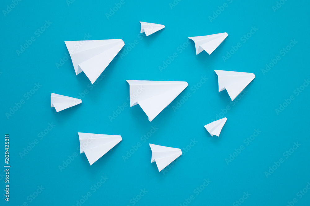 White paper planes on a blue background. Telegram symbol White paper planes on a blue background. Telegram symbol