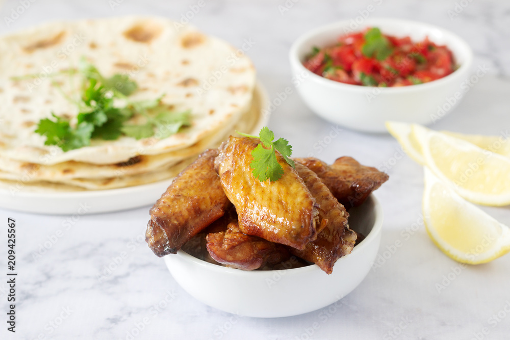 Homemade delicious food of tortillas, salsa and fried wings. Homemade delicious food of tortillas, salsa and fried wings.