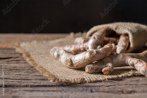Turmeric on wooden background