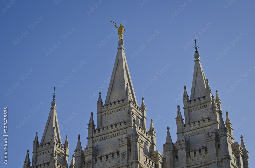 A view of golden moroni on the salt lake city temple in the evening summer sun. 