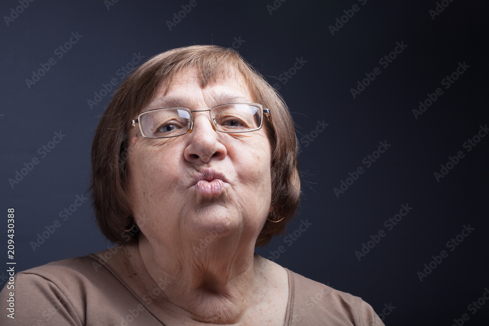 Studio portrait of elderly woman. Kiss Studio portrait of elderly woman. Kiss