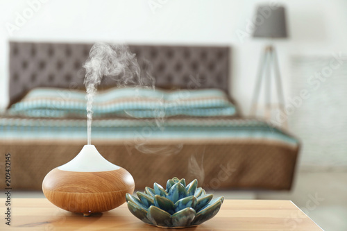 Tableau sur toile Aroma oil diffuser on table at home. Air freshener