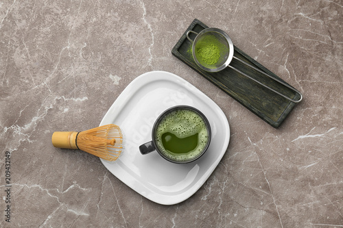 Flat lay composition with matcha tea on table