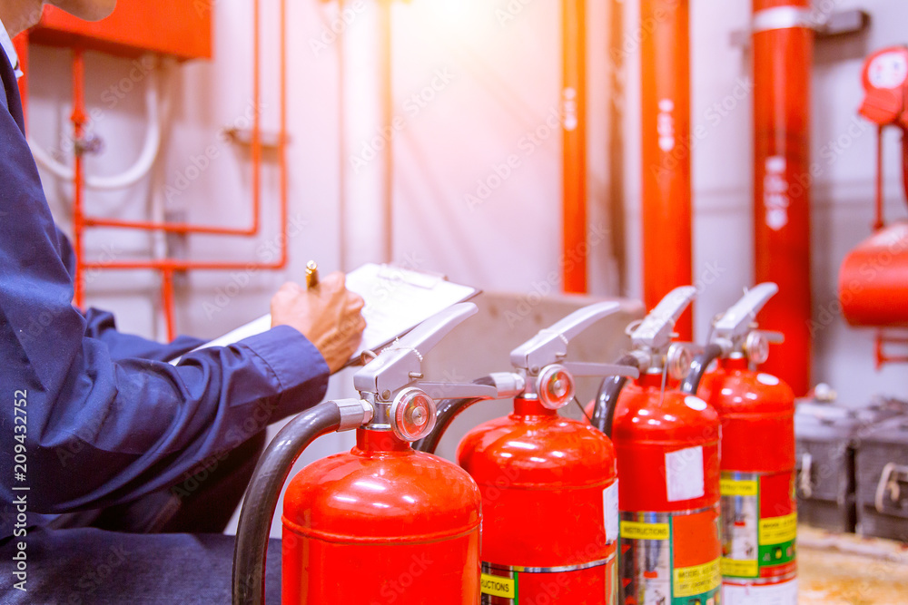 Engineer checking Industrial fire control system,Fire Alarm controller, Fire notifier, Anti fire.System ready In the event of a fire. Engineer checking Industrial fire control system,Fire Alarm controller, Fire notifier, Anti fire.System ready In the event of a fire.