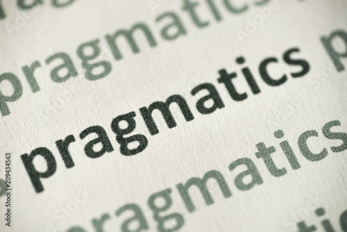 word pragmatics  printed on paper macro