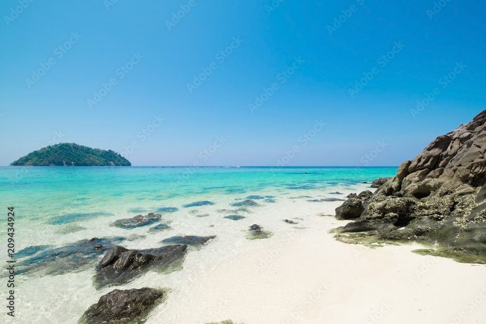 Beautiful white sand beach with  island in summer time concept travel, holiday and vacation. Tropical paradise beach nature landscape in Thailand