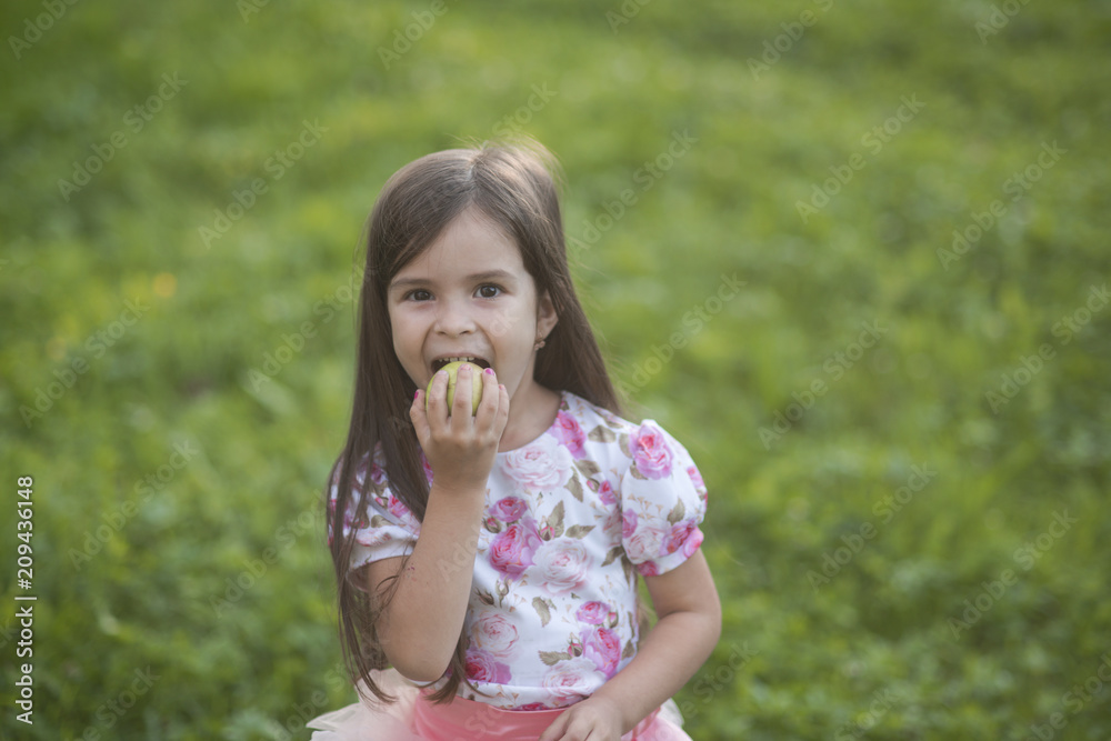 Girl eat apple on natural background, vitamin Girl eat apple on natural background, vitamin