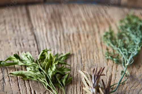 Parsley and dill on wooden background, top view, close-up, selective focus. photo