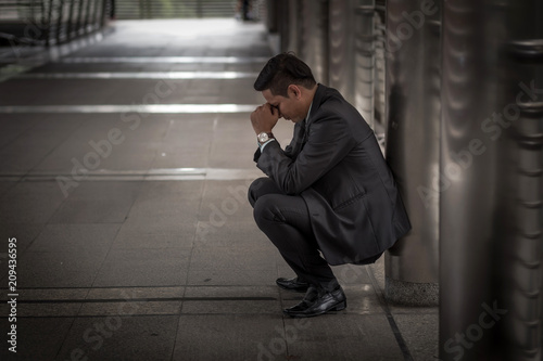 Business man tired or stressed after his work. Image of Stressed businessman concept.