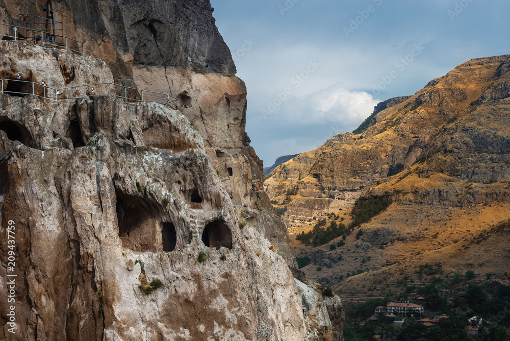 Cave monastery of Vardzia, on the bank of the river Mtkvari. Samtskhe-Javakheti region, Georgia. City in the rock. Landscape.