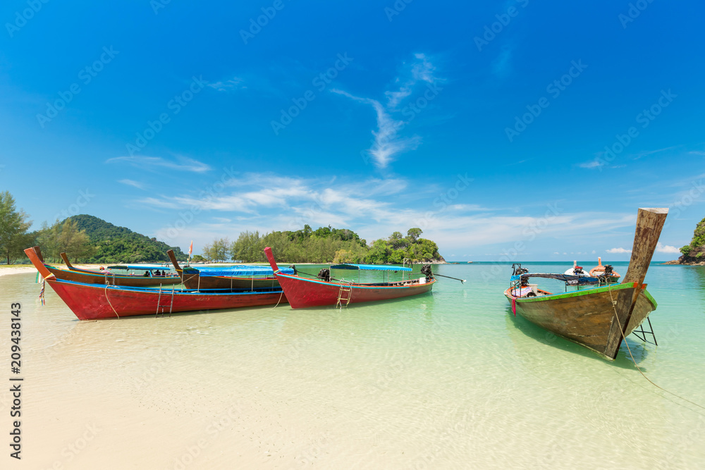 White sand beach and Long-tail boat at Kham-Tok Island (koh-kam-tok), The beautiful sea Ranong Province, Thailand.