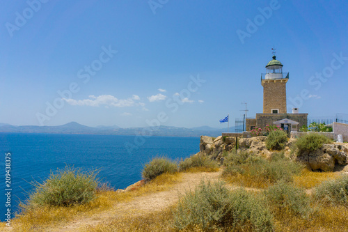 Melagavi lighthouse with endless blue sea in the background in Loutraki, Peloponnese Greece photo