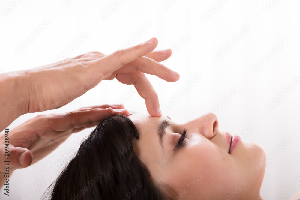 Fototapeta premium Calm Woman Receiving Reiki Treatment