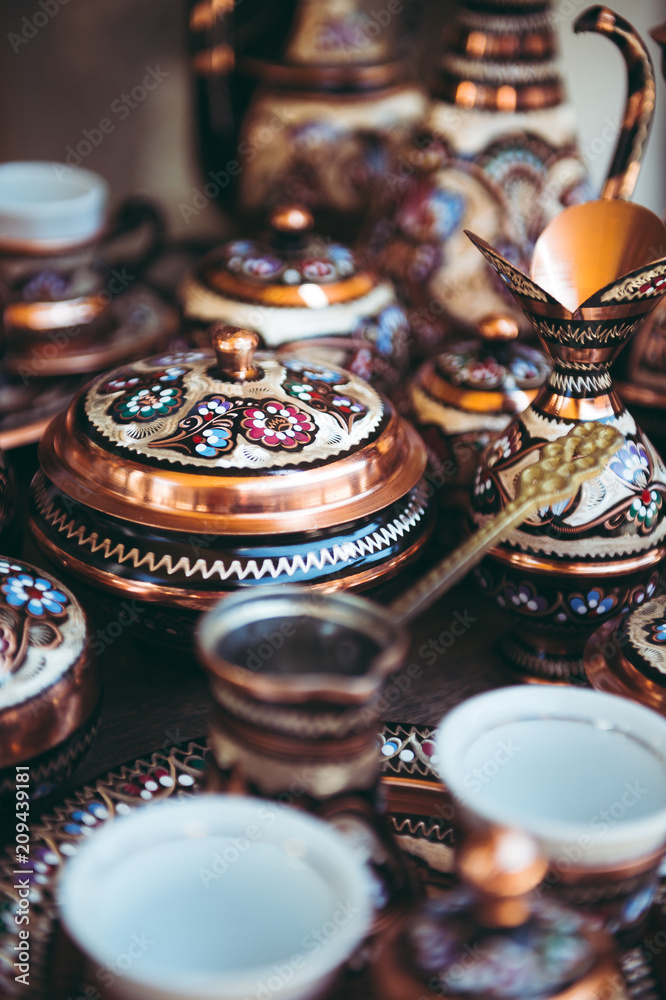 Fototapeta premium Bosnian copper pots and pans on a market table in Sarajevo