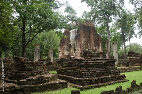 View landscape of buddha statue at Wat Phra Si Iriyabot in ancient building and ruins city of Kamphaeng Phet Historical Park photo