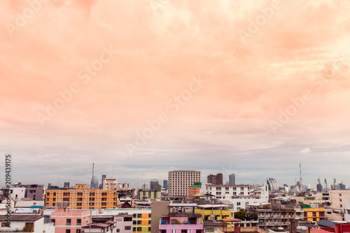Bird view over cityscape with sun and clouds in the morning.Copy space.Bangkok.Pastel tone.
