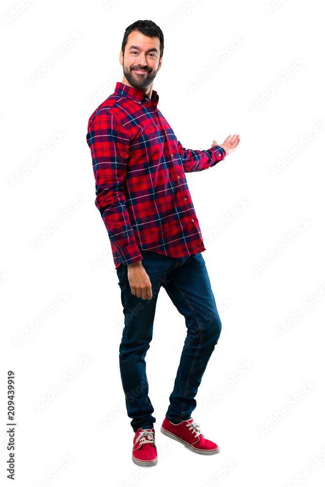 Handsome man presenting and inviting to come Handsome man presenting and inviting to come