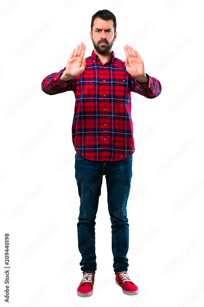 Handsome man making stop gesture with her hand Handsome man making stop gesture with her hand