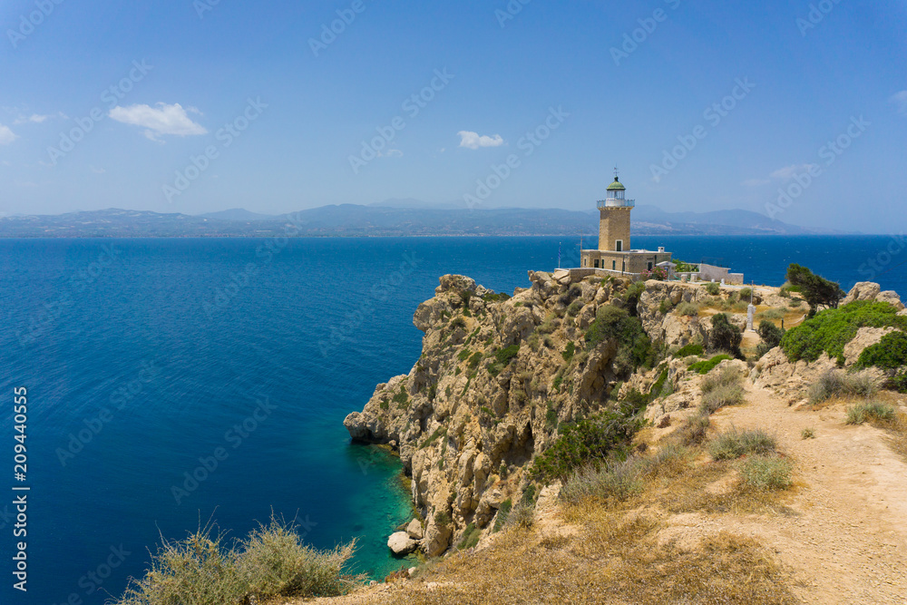 Melagavi lighthouse with endless blue sea in the background in Loutraki, Peloponnese Greece