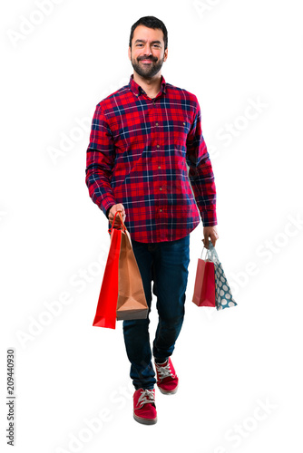 Handsome man holding a lot of shopping bags