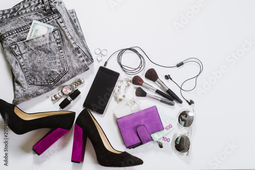 Womens clothes and accessories flatlay on white background. Top view. Copy space