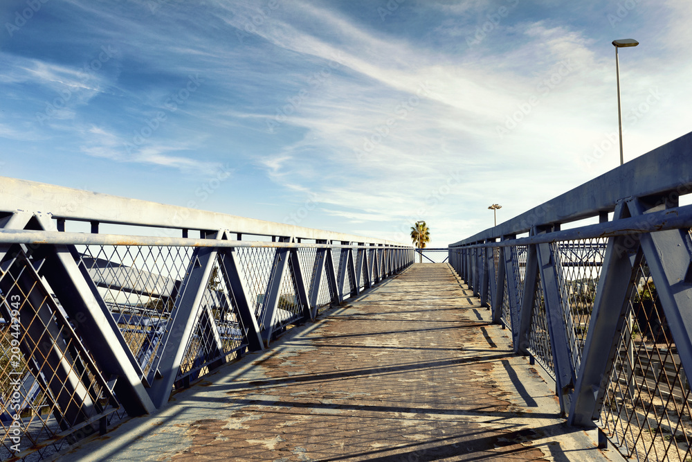 metal overpass bridge to the blue sky