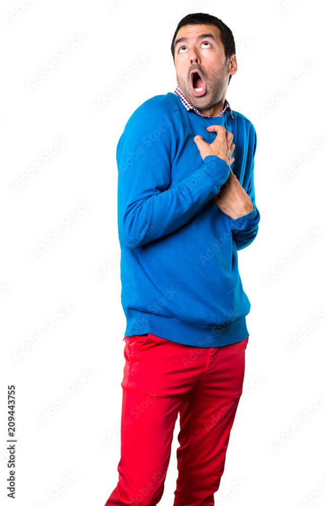 Handsome young man looking up on white background Handsome young man looking up on white background