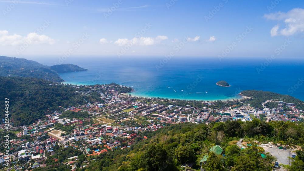 Kata beach, Phuket, Thailand. January, 2018. Aerial shot in the morning above the beach and sea with many tourist and boats.