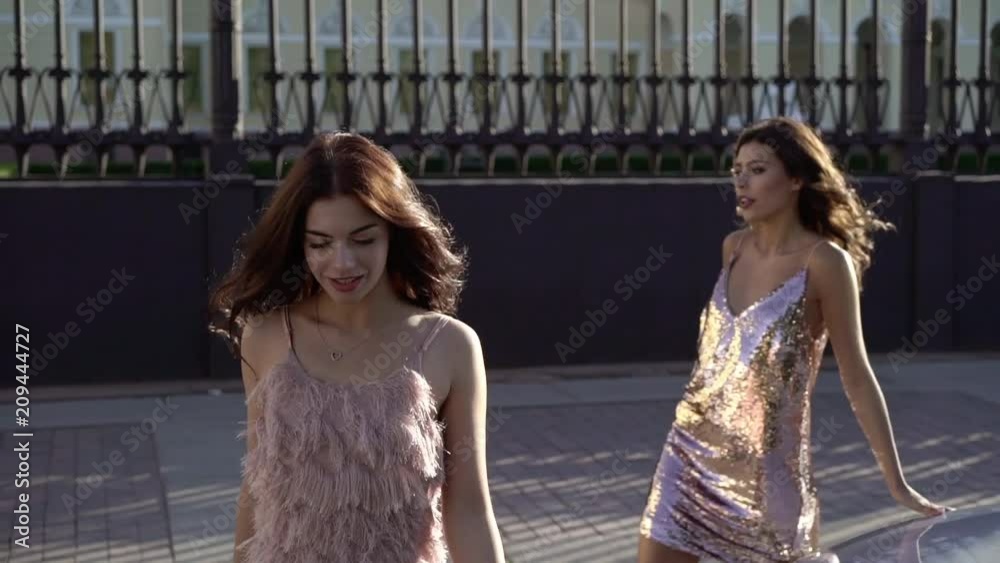 custom made wallpaper toronto digitalTwo young woman posing near luxury sports car in a city