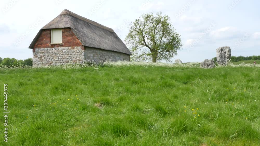 House in the middle of the Stone circle at Avebury, a neolithic henge monument and an Unesco World Heritage site, Wiltshire England