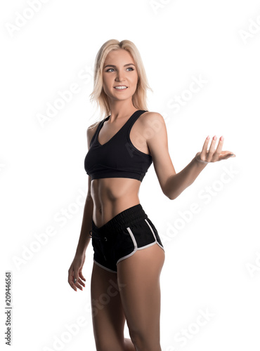 Sporty blonde in sexy top and shorts isolated view