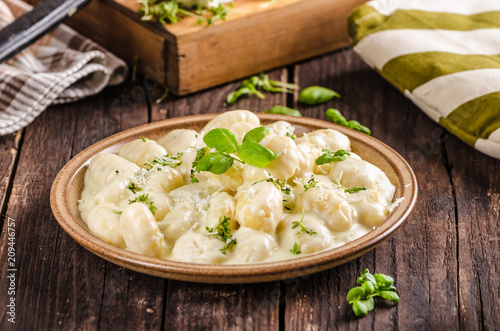 Cheese gnocchi with blue cheese sauce and galic
