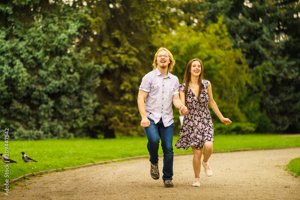 Happy couple playing in park Happy couple playing in park