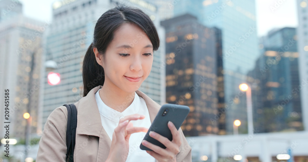 Woman use of smart phone in city Woman use of smart phone in city