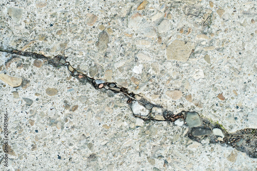 Cracked concrete texture background. Copy space